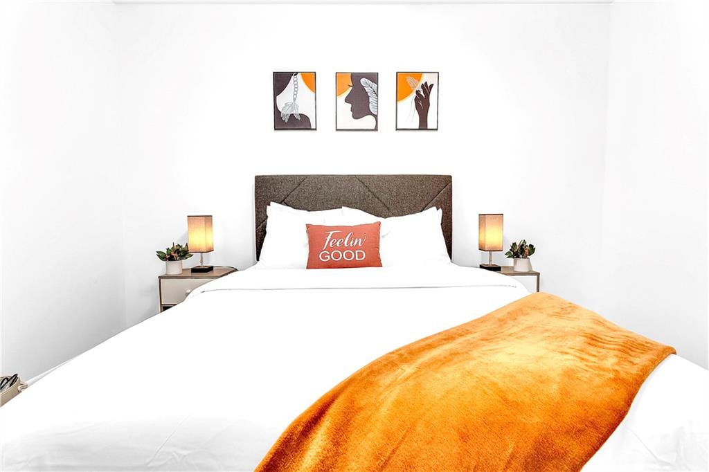 3571 Turner Heights Drive Decatur, GA 30032 - Photo 33 of 51 a bedroom with a bed and a painting on the wall