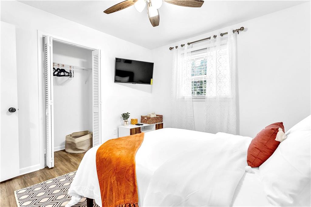 3571 Turner Heights Drive Decatur, GA 30032 - Photo 34 of 51 a bedroom with a bed and a flat screen tv