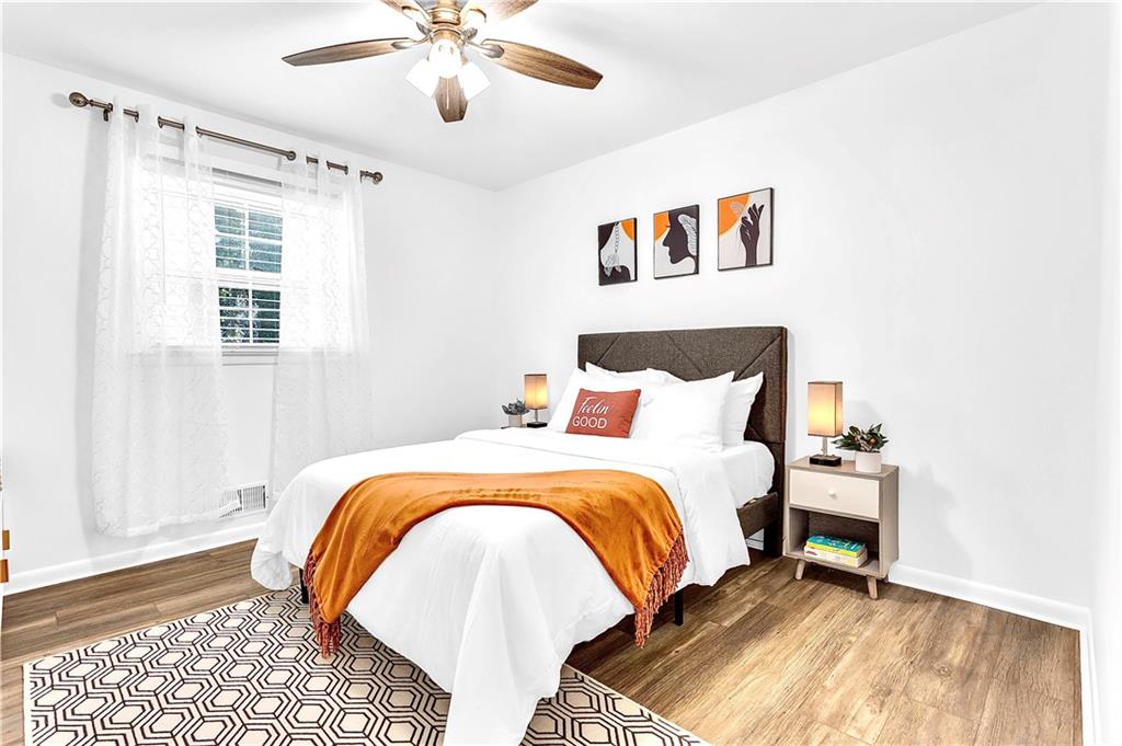 3571 Turner Heights Drive Decatur, GA 30032 - Photo 35 of 51 a bedroom with a bed and a painting on the wall