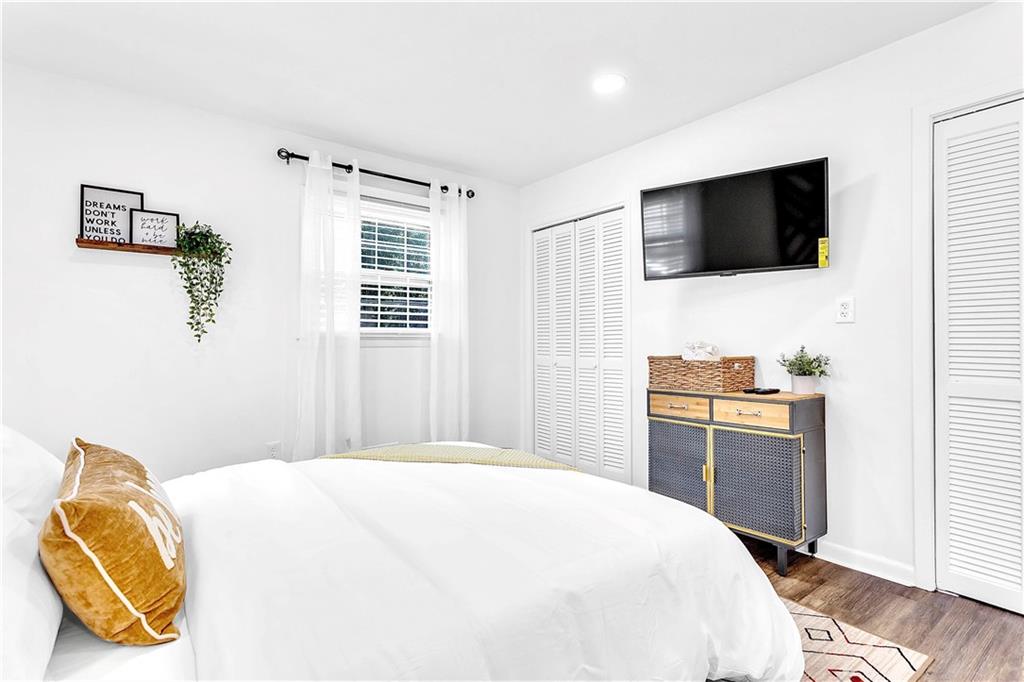 3571 Turner Heights Drive Decatur, GA 30032 - Photo 44 of 51 a bedroom with a bed and a flat screen tv