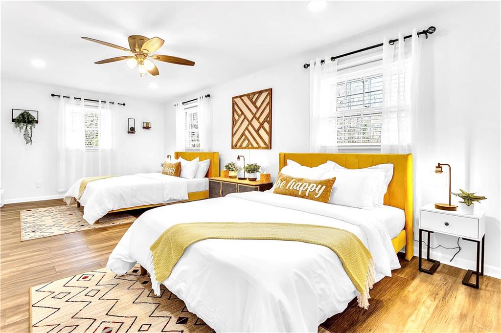 3571 Turner Heights Drive Decatur, GA 30032 - Photo 46 of 51 a bedroom with a bed and a chandelier