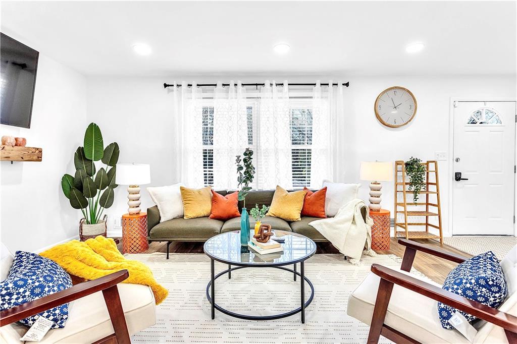3571 Turner Heights Drive Decatur, GA 30032 - Photo 9 of 51 a living room with furniture a rug potted plant and a window