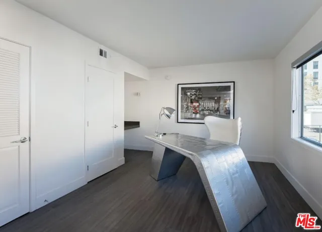 a workspace with furniture and window