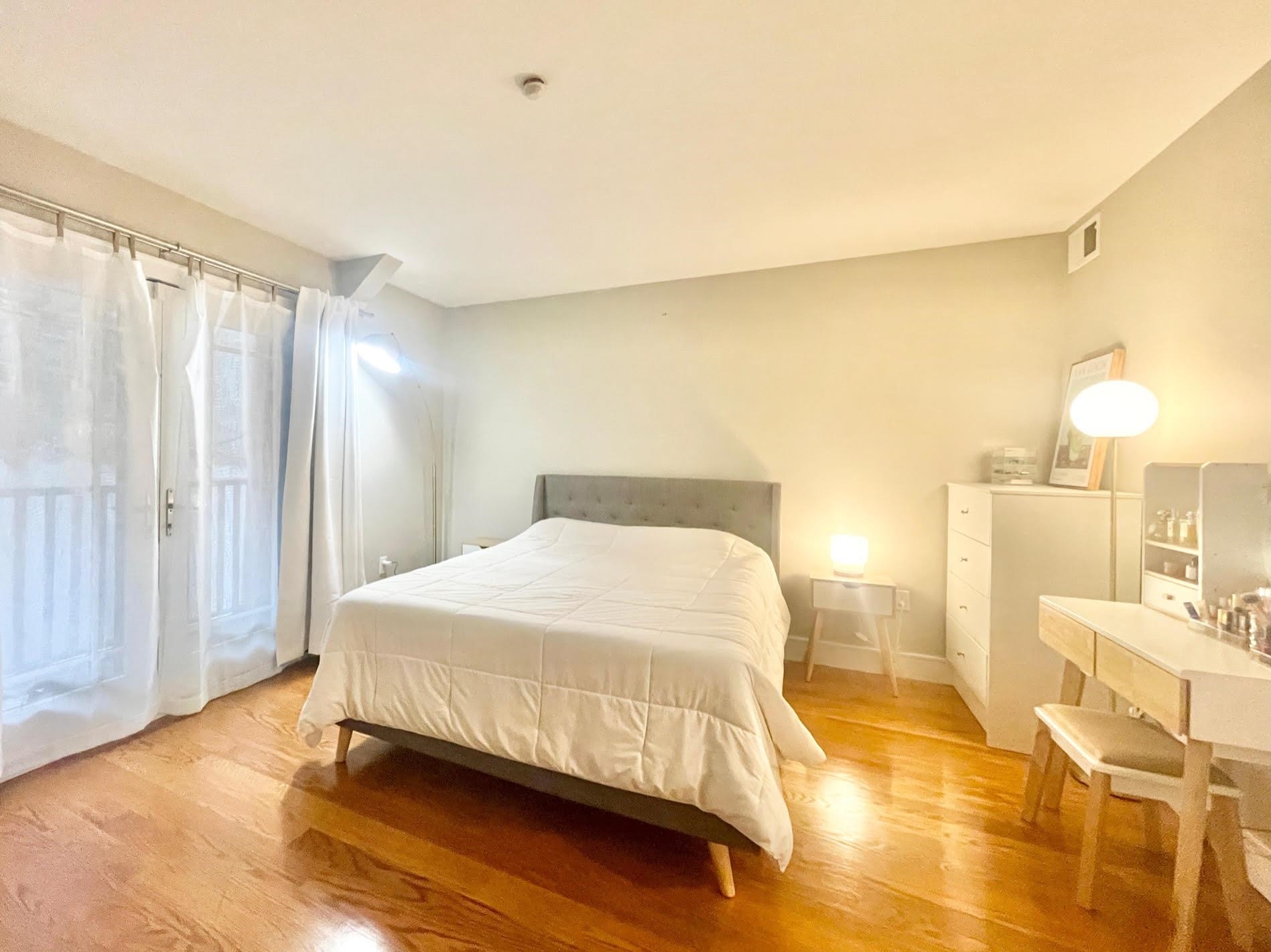 8917 Old River Road, Unit 5 Edgewater, NJ 07047 - Photo 7 of 7 a bedroom with a bed and wooden floor