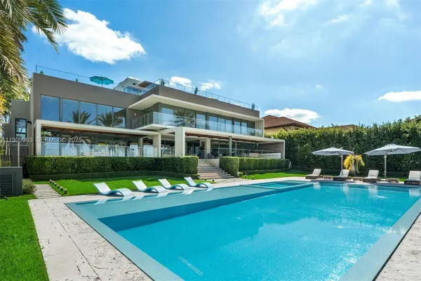 a view of a swimming pool with lounge chair
