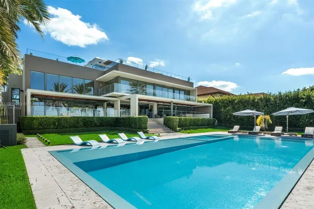 a view of swimming pool with a table and chairs