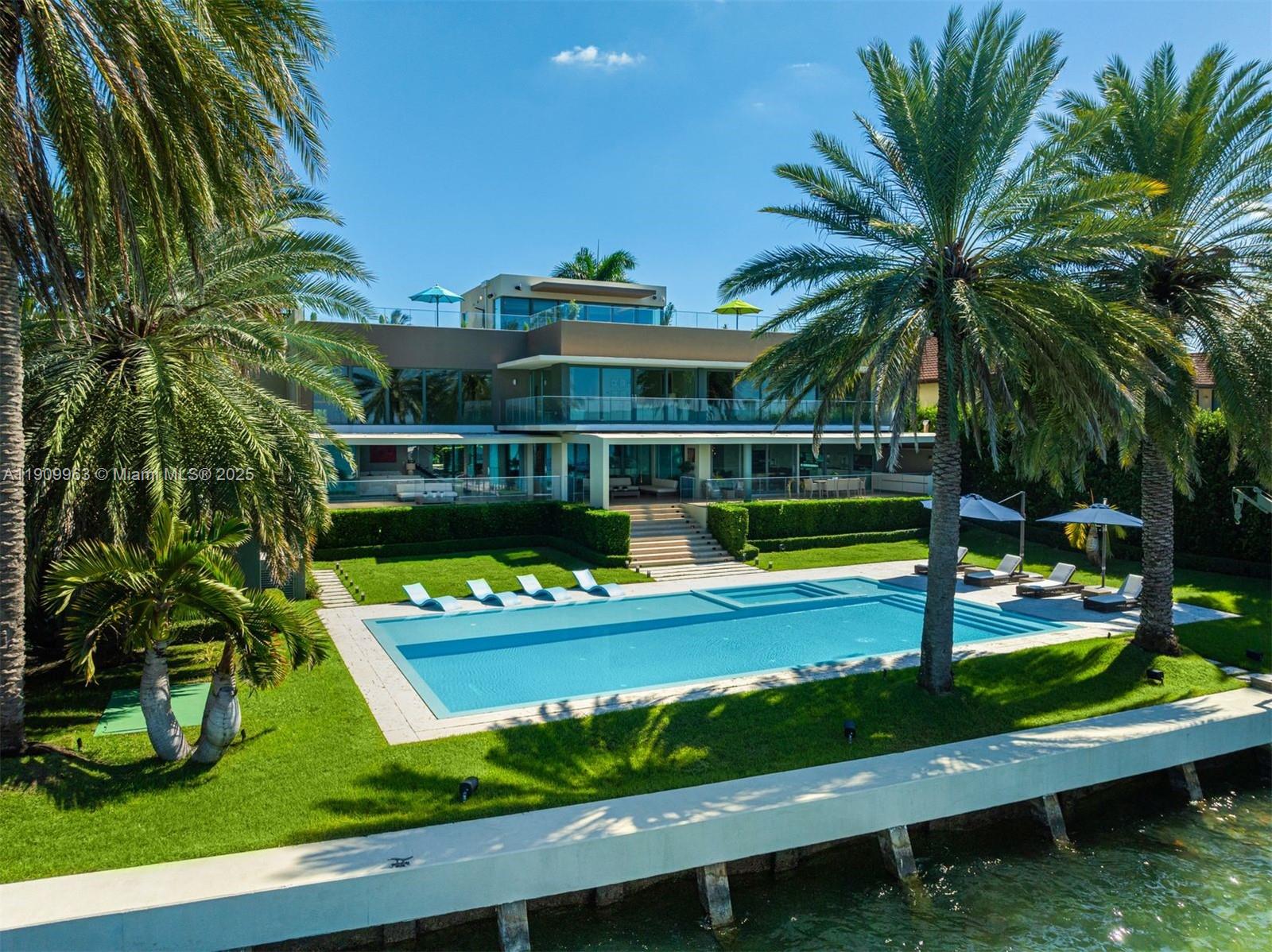 360 Harbor Drive Key Biscayne, FL 33149 - Photo 16 of 86 a view of a swimming pool with a garden and seating area