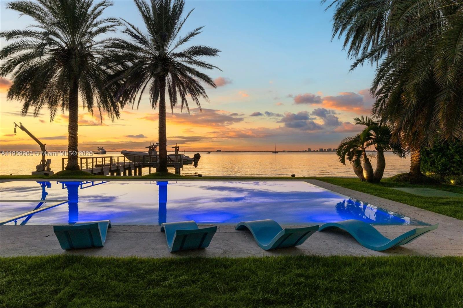 360 Harbor Drive Key Biscayne, FL 33149 - Photo 28 of 86 a view of swimming pool with a table and chairs