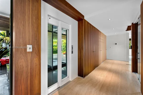 a spacious bedroom with a bed and a large window