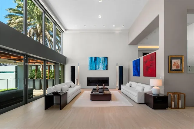 a bathroom with a sink a toilet a mirror and shower