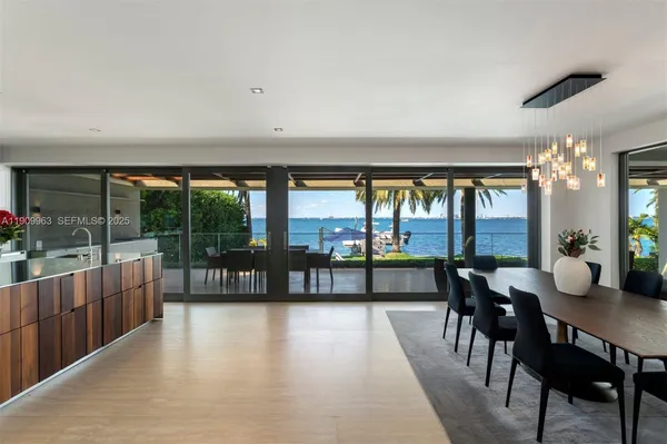 a view of swimming pool with outdoor seating and lake view