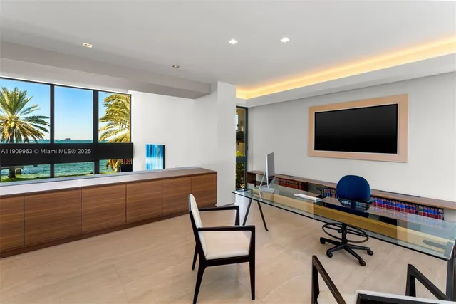 a view of a swimming pool with lawn chairs and plants