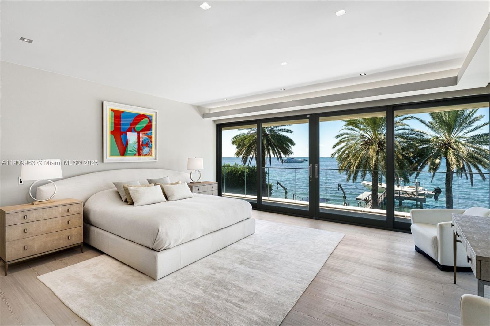 360 Harbor Drive Key Biscayne, FL 33149 - Photo 49 of 86 a spacious bedroom with a large bed and a large window