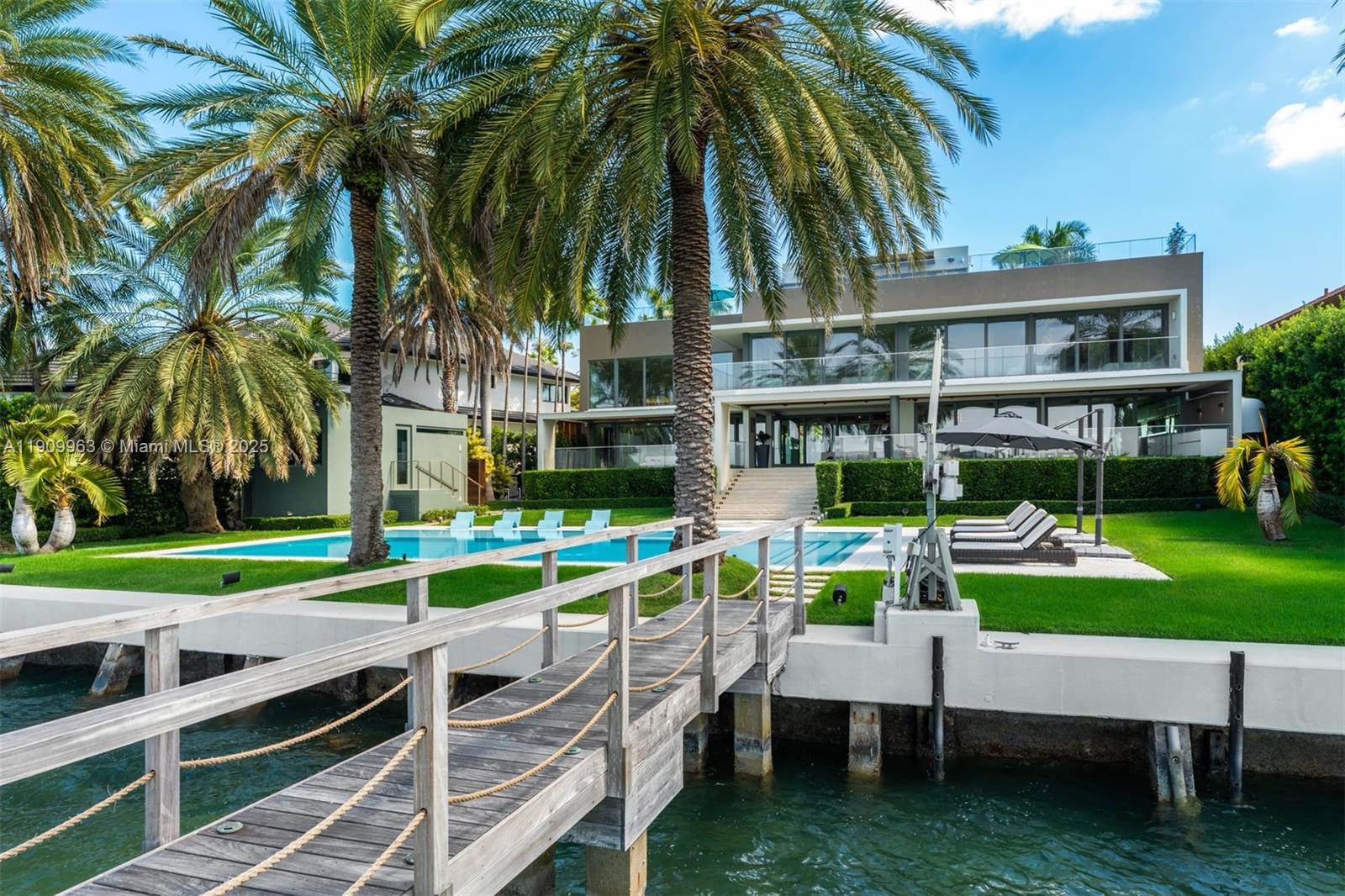 360 Harbor Drive Key Biscayne, FL 33149 - Photo 79 of 86 a view of a house with a yard and sitting area