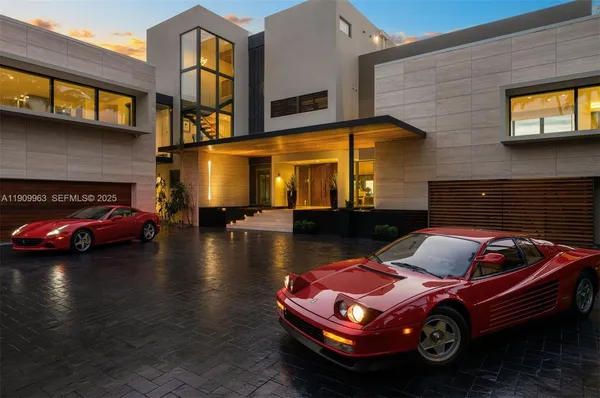 a view of swimming pool with lawn chairs and a big yard