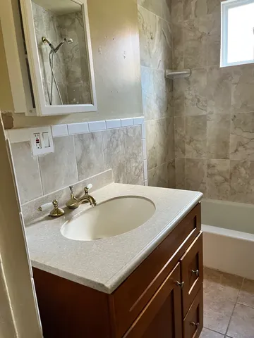 a bathroom with a sink and a mirror