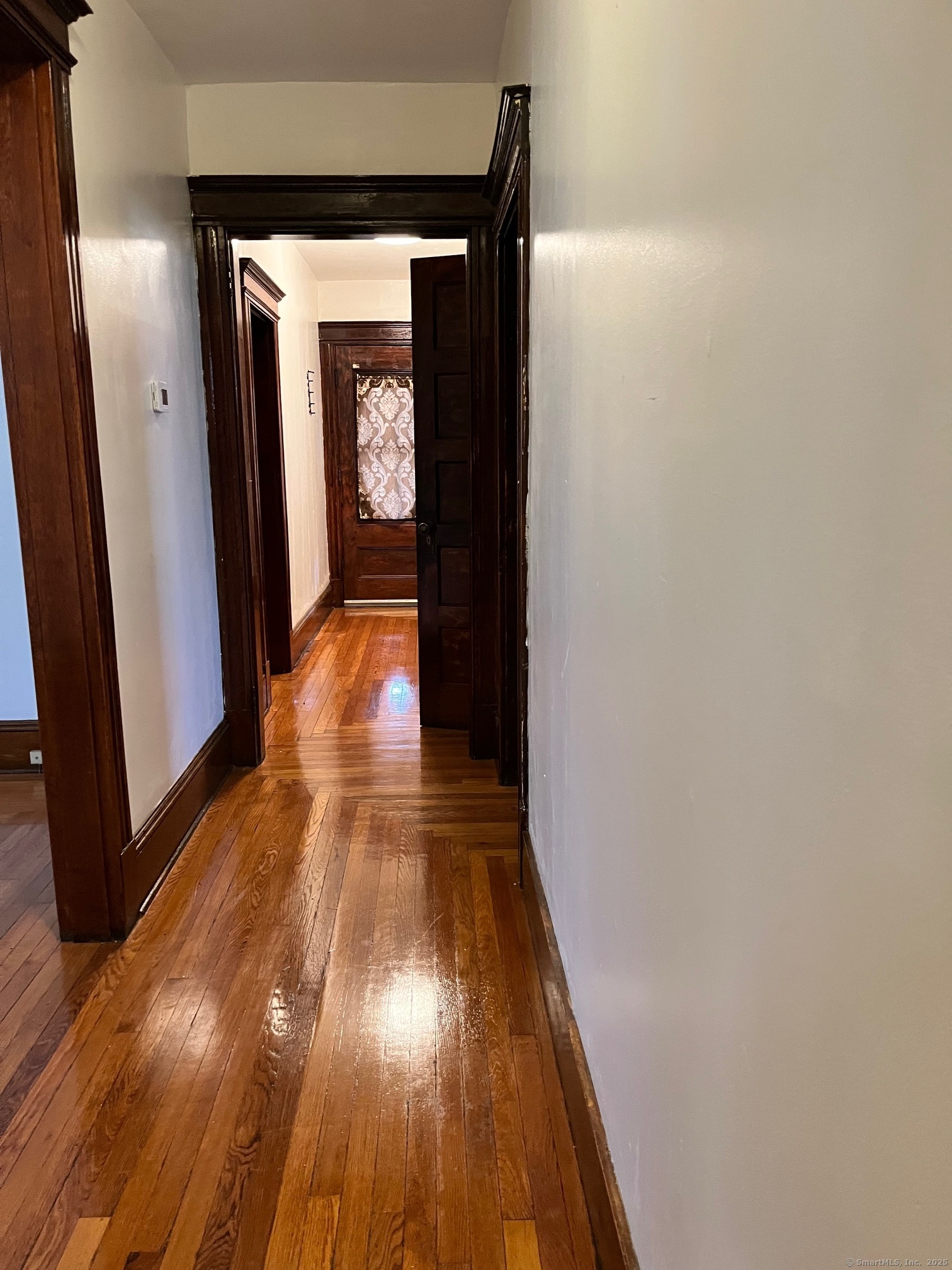 308 Edgewood Street, Unit 1 Hartford, CT 06112 - Photo 12 of 23 a view of a hallway with wooden floor
