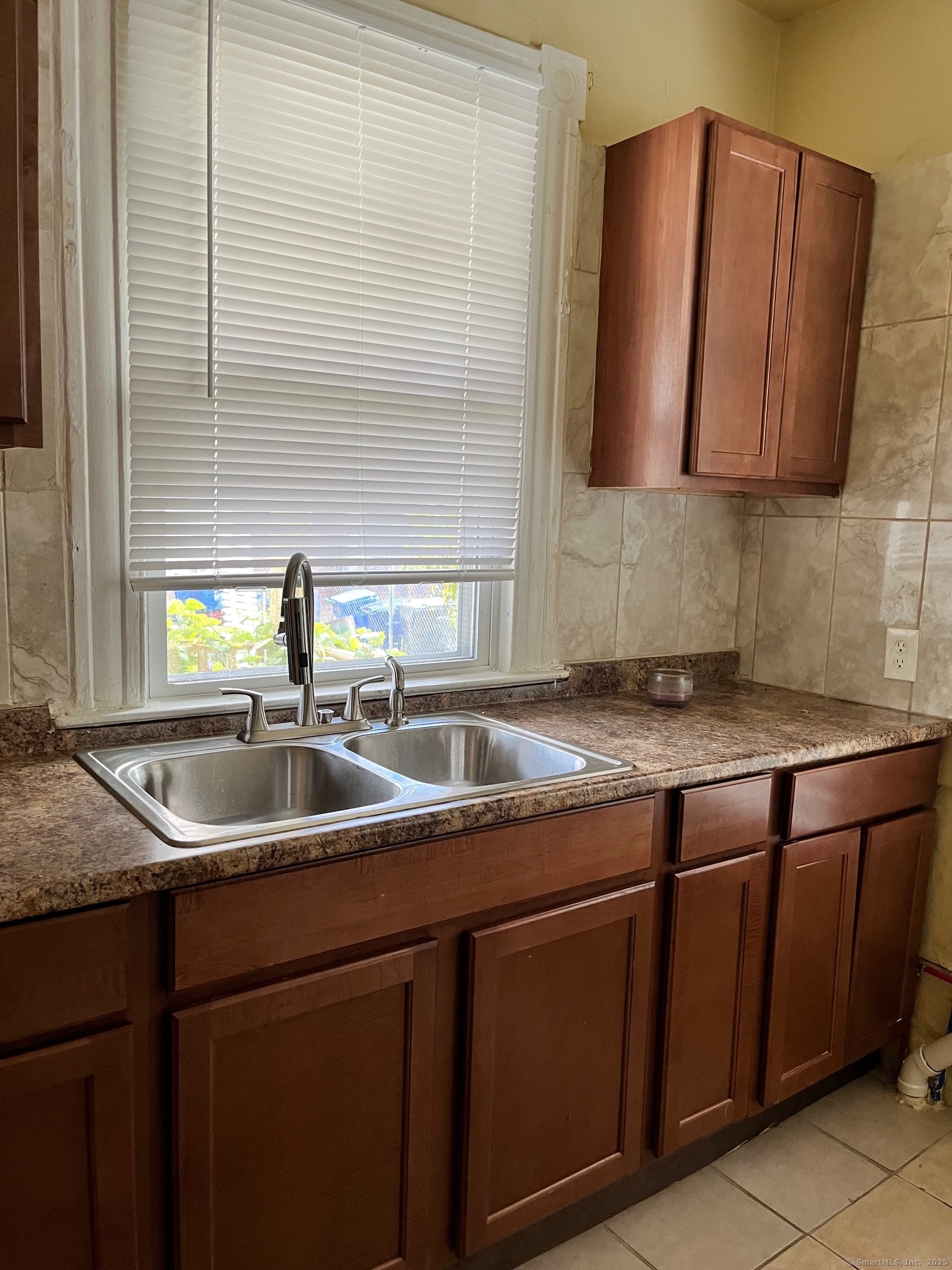308 Edgewood Street, Unit 1 Hartford, CT 06112 - Photo 7 of 23 a kitchen with stainless steel appliances granite countertop a sink and a wooden cabinets