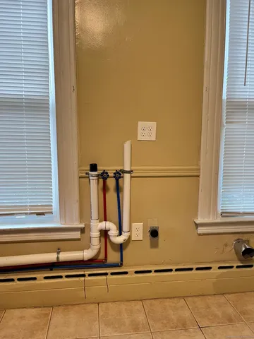 a view of a balcony with chairs