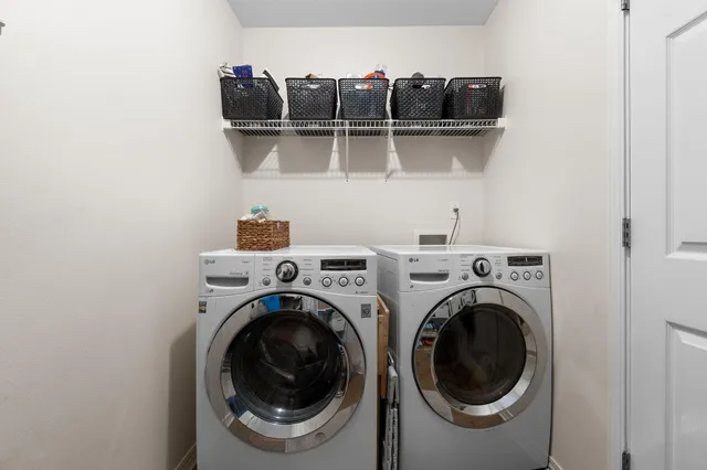 a view of a storage and utility room with racks on the wall