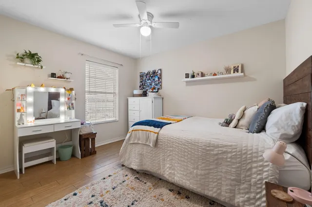 a bedroom with a bed and a window