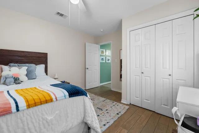 a bedroom with a bed and a couch