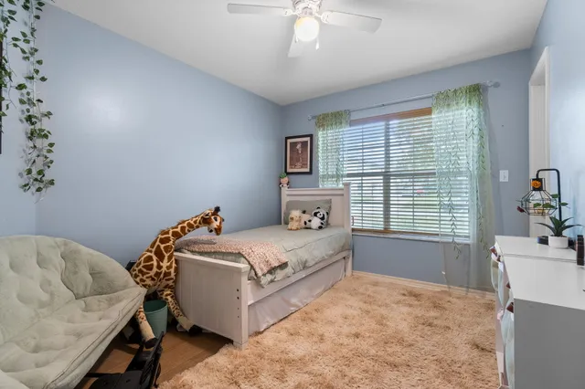 a bedroom with a bed and a couch