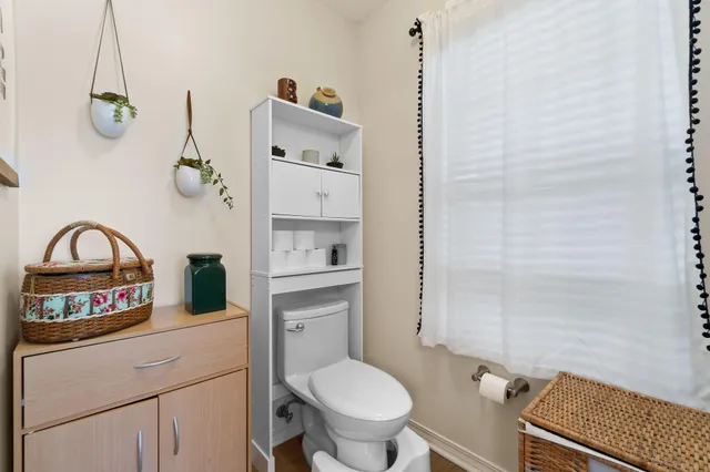 a bathroom with a toilet a sink and a shower