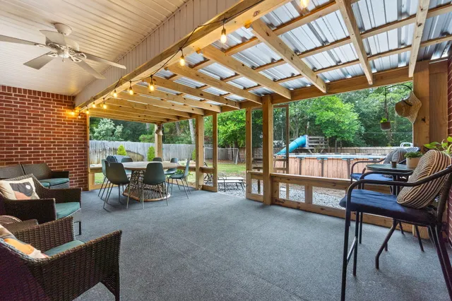 a view of a dining room with furniture window and outside view
