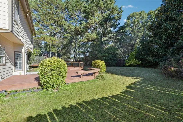 an aerial view of a house with a garden
