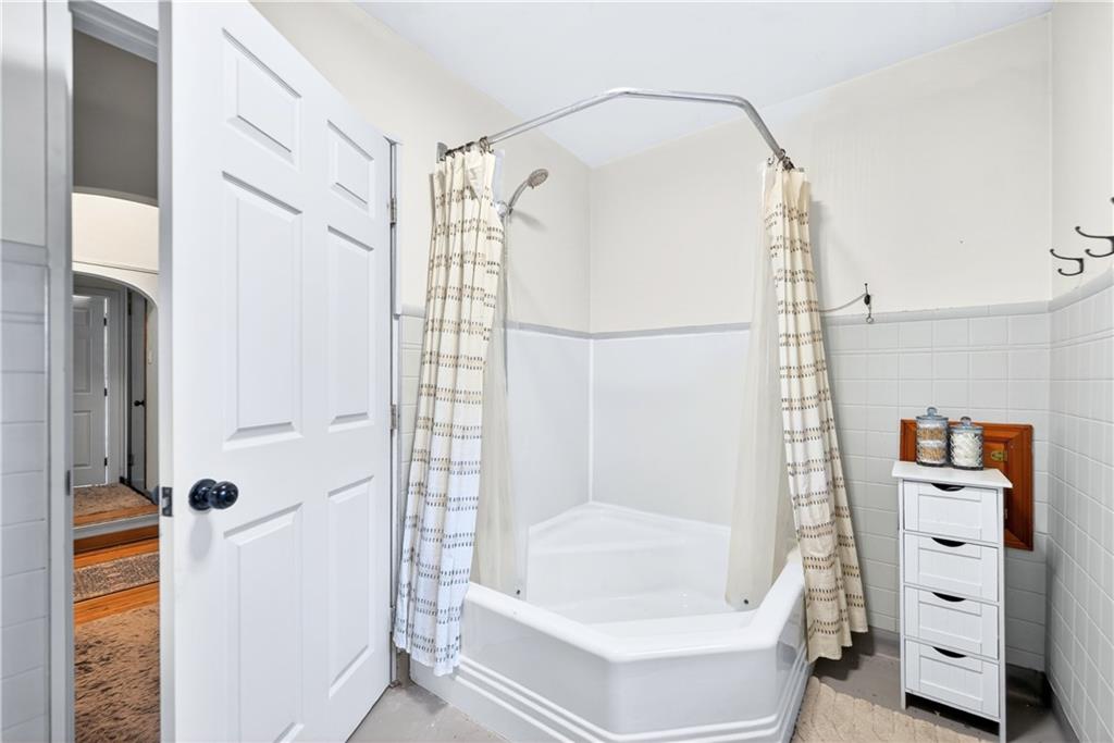 1188 Willowbrook Road Belle Vernon, PA 15012 - Photo 38 of 50 a bathroom with a tub a sink and a shower