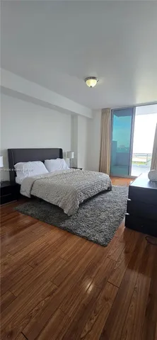 a bedroom with a bed and a walk in closet