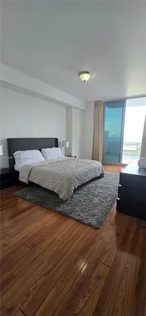 a bedroom with a bed and a walk in closet