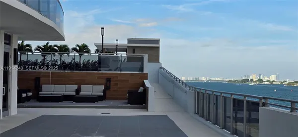 a view of roof deck with seating space