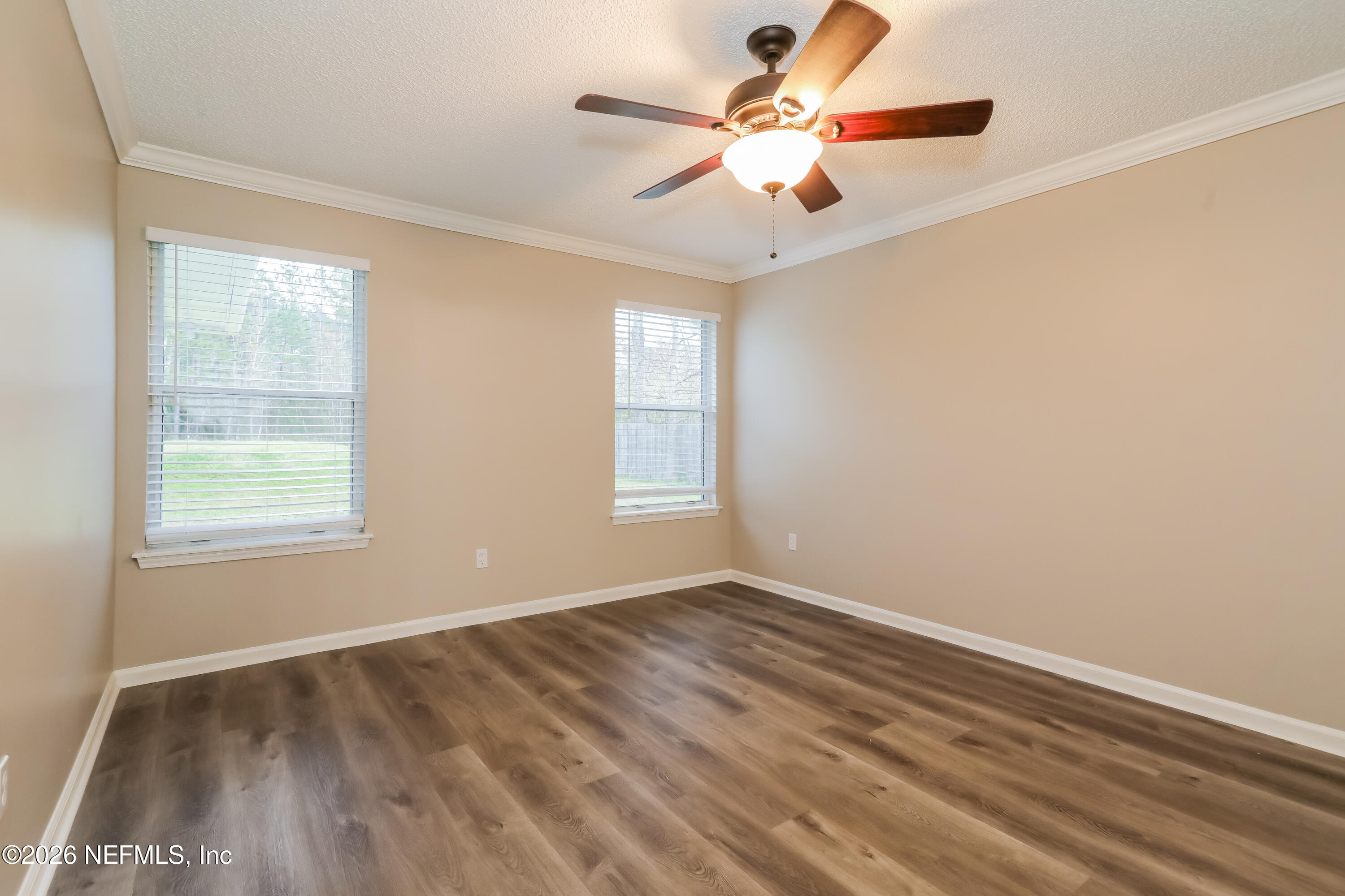 4088 Everett Avenue Middleburg, FL 32068 - Photo 9 of 16 wooden floor in an empty room with a window