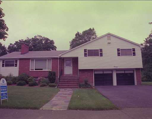 20 Brandeis Road Newton, MA 02459 - Photo 1 of 1 a front view of a house with a yard