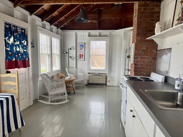 24 Washington Avenue Nantucket, MA 02554 - Photo 2 of 9 a kitchen with a sink a table and chairs