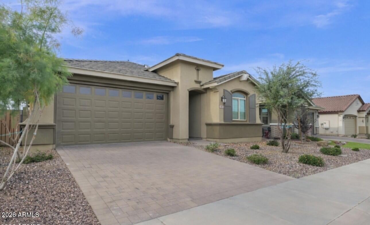 3461 West Oil Well Road San Tan Valley, AZ 85144 - Photo 1 of 19 a front view of a house with a yard and garage