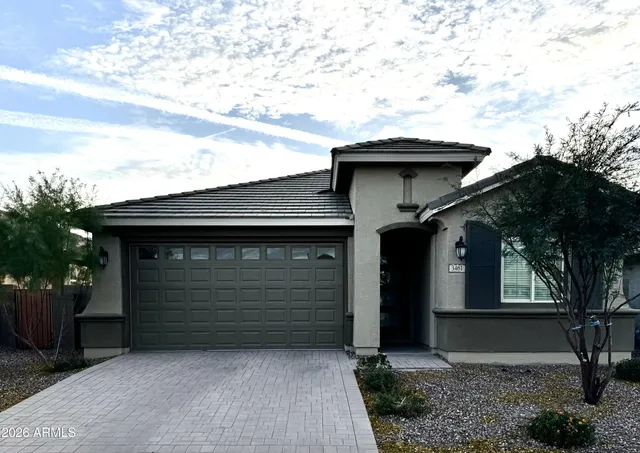 a front view of a house with a garage