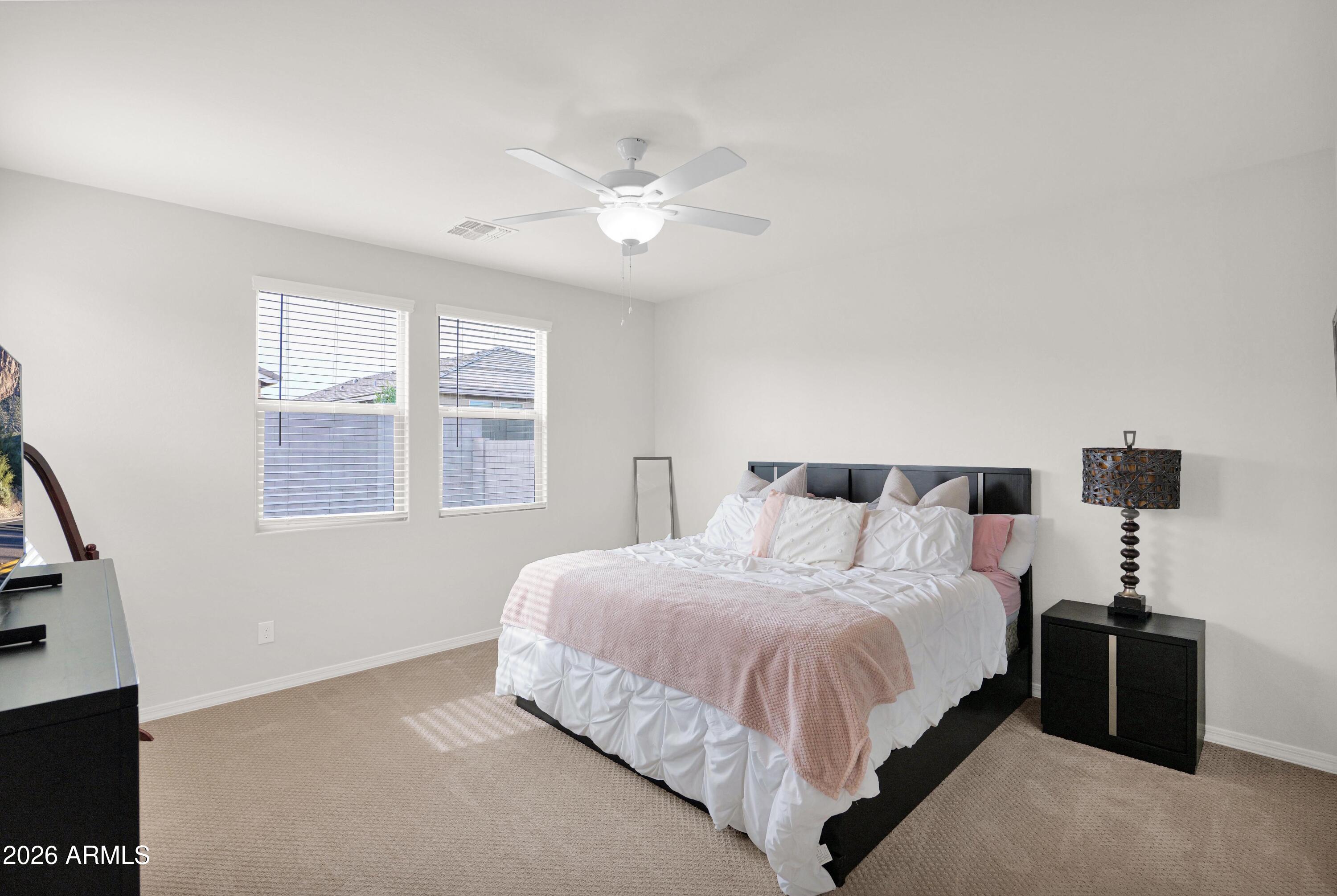 3461 West Oil Well Road San Tan Valley, AZ 85144 - Photo 11 of 25 a bedroom with a bed and a window