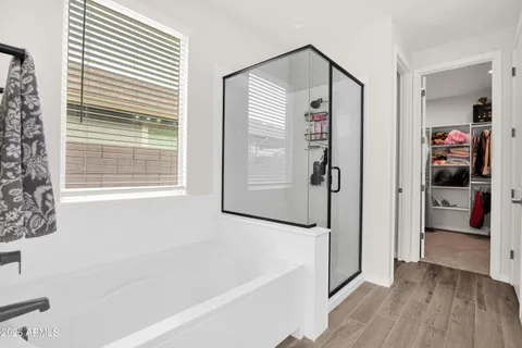 a bathroom with a bathtub and a shower