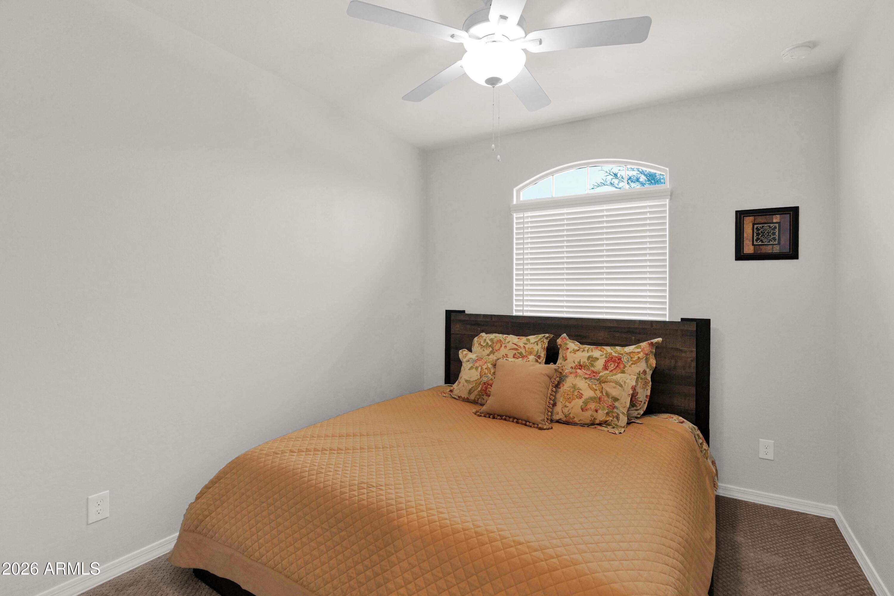 3461 West Oil Well Road San Tan Valley, AZ 85144 - Photo 15 of 25 a bedroom with a bed and a window