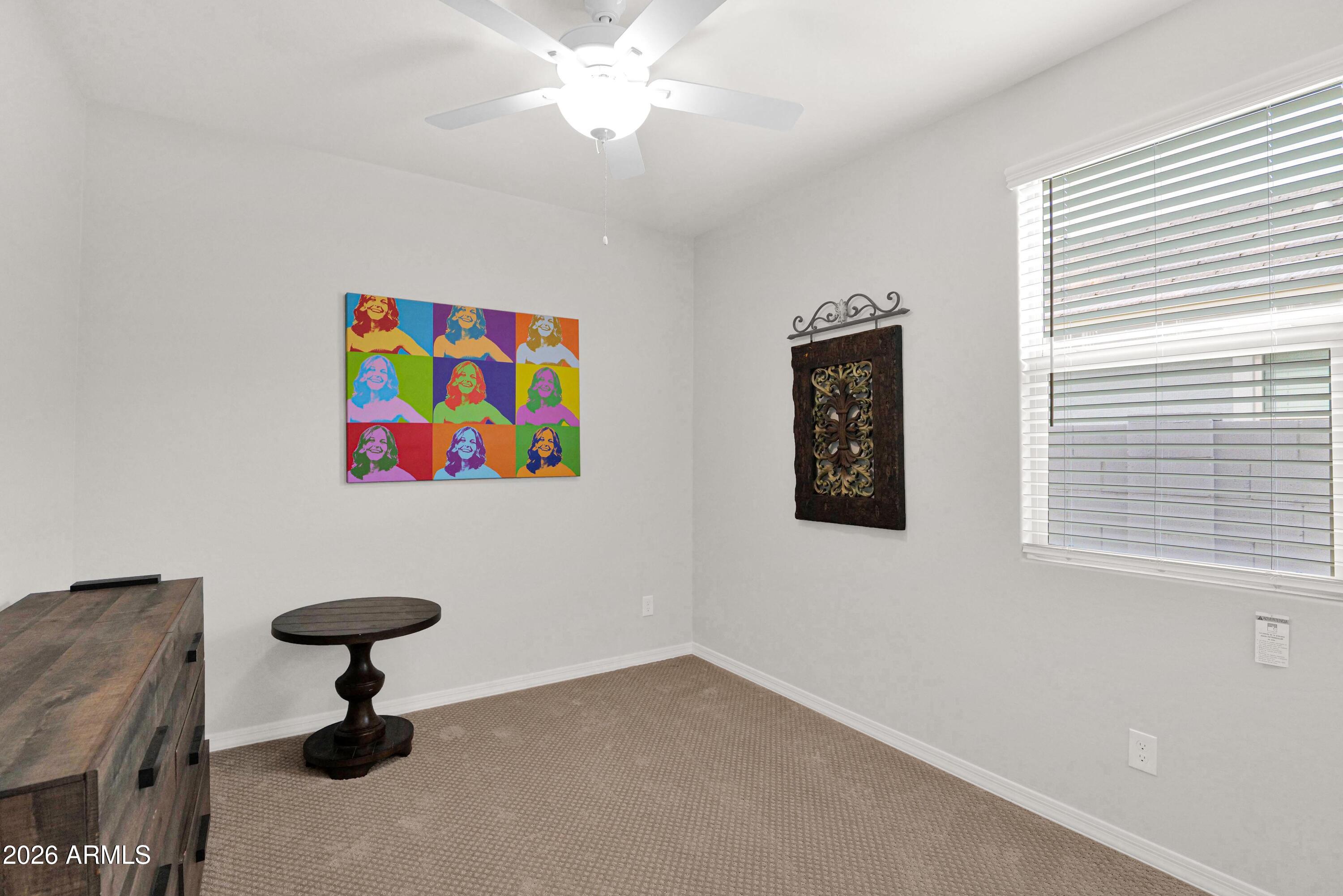 3461 West Oil Well Road San Tan Valley, AZ 85144 - Photo 17 of 25 a view of a livingroom with a window and wooden floor