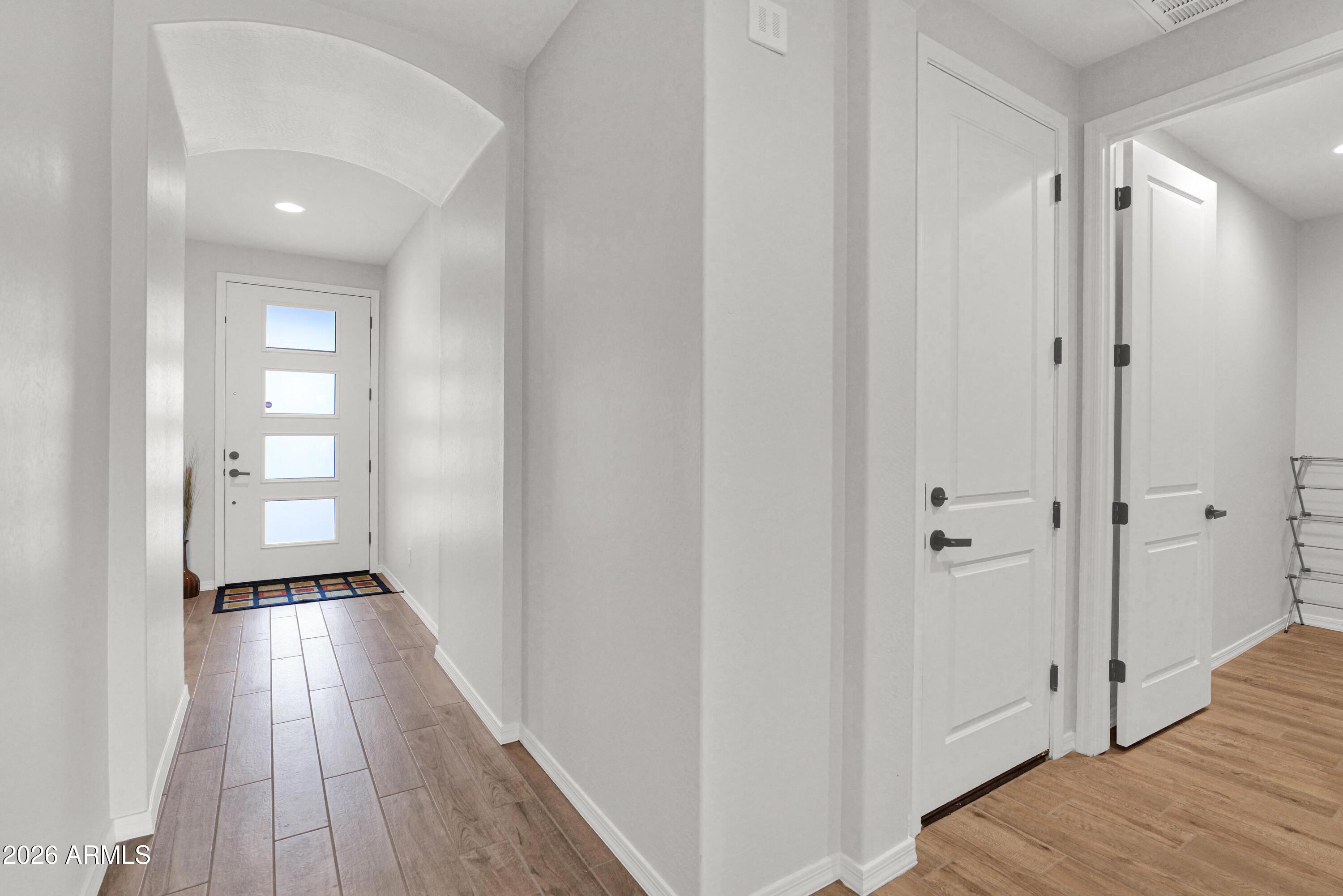 3461 West Oil Well Road San Tan Valley, AZ 85144 - Photo 20 of 25 a view of a hallway with wooden floor