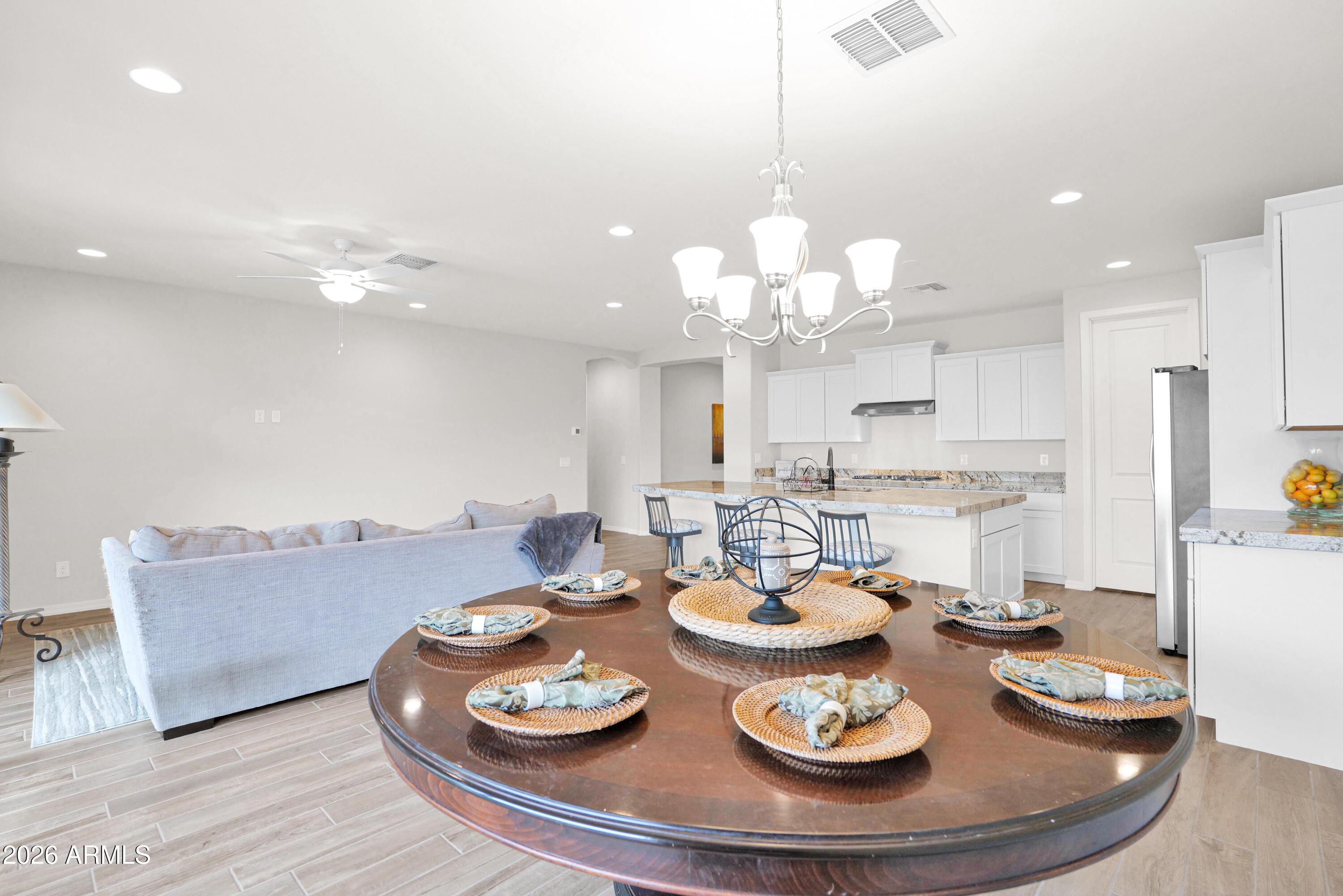 3461 West Oil Well Road San Tan Valley, AZ 85144 - Photo 10 of 25 a open dining room with furniture