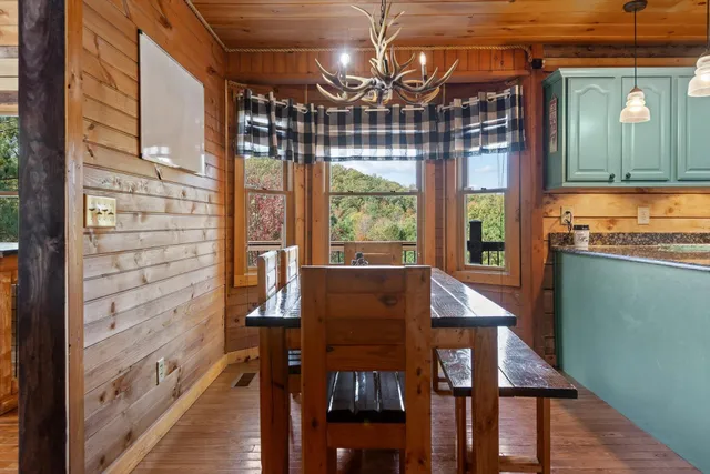 a spacious bathroom with a sink a mirror a bathtub and a toilet