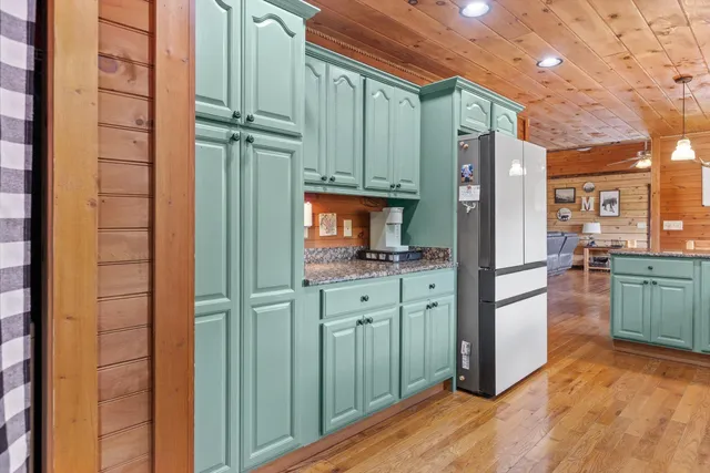 a room with wooden furniture and windows