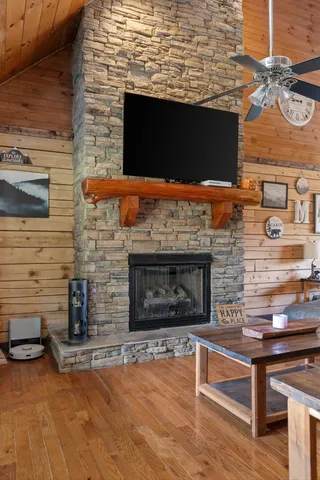 a balcony with chairs and wooden floor
