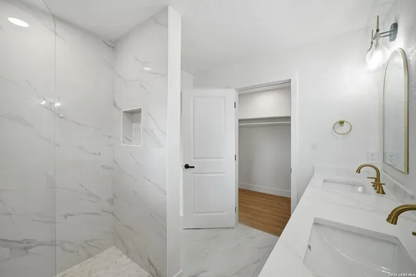 a bathroom with a sink and shower