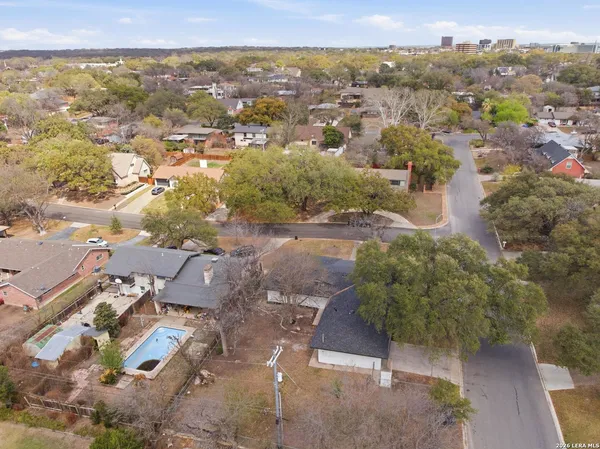 an aerial view of residential houses with outdoor space